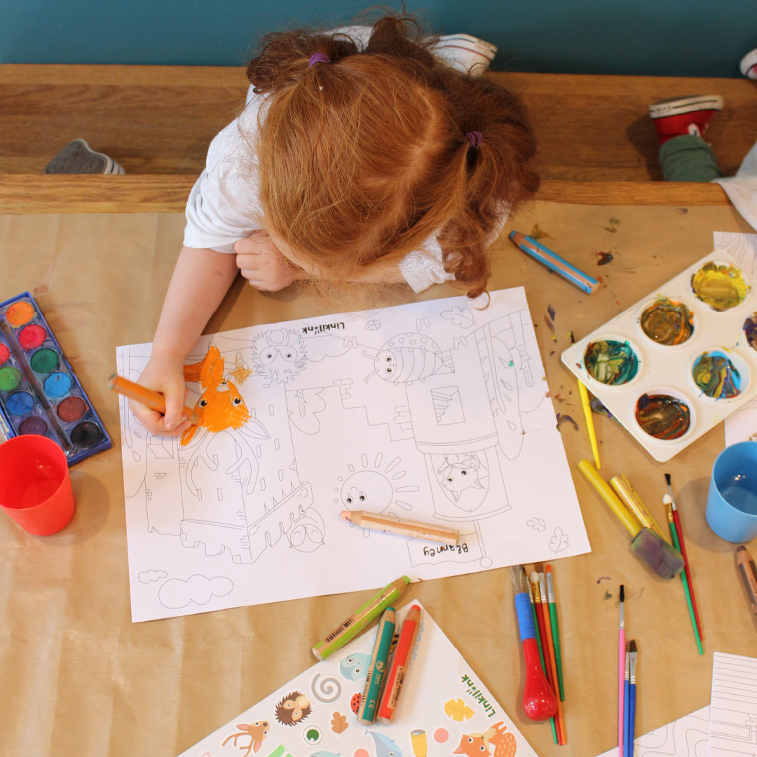 A photo of a child enjoying the Linkilonk Activity pages. Celebrating Ireland through creativity